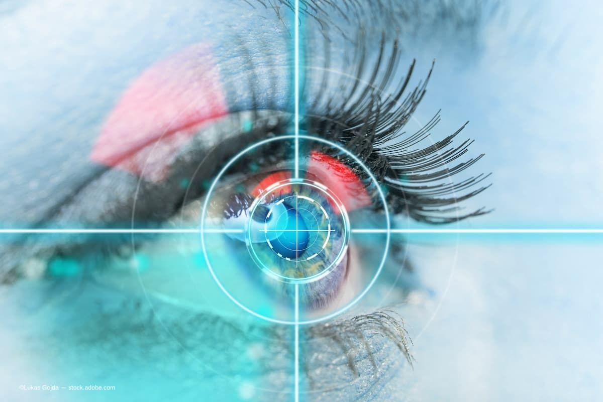 a close image of an eye with crosshairs on the eye and a laser going into it. (Image Credit: AdobeStock/Lukas Gojda)