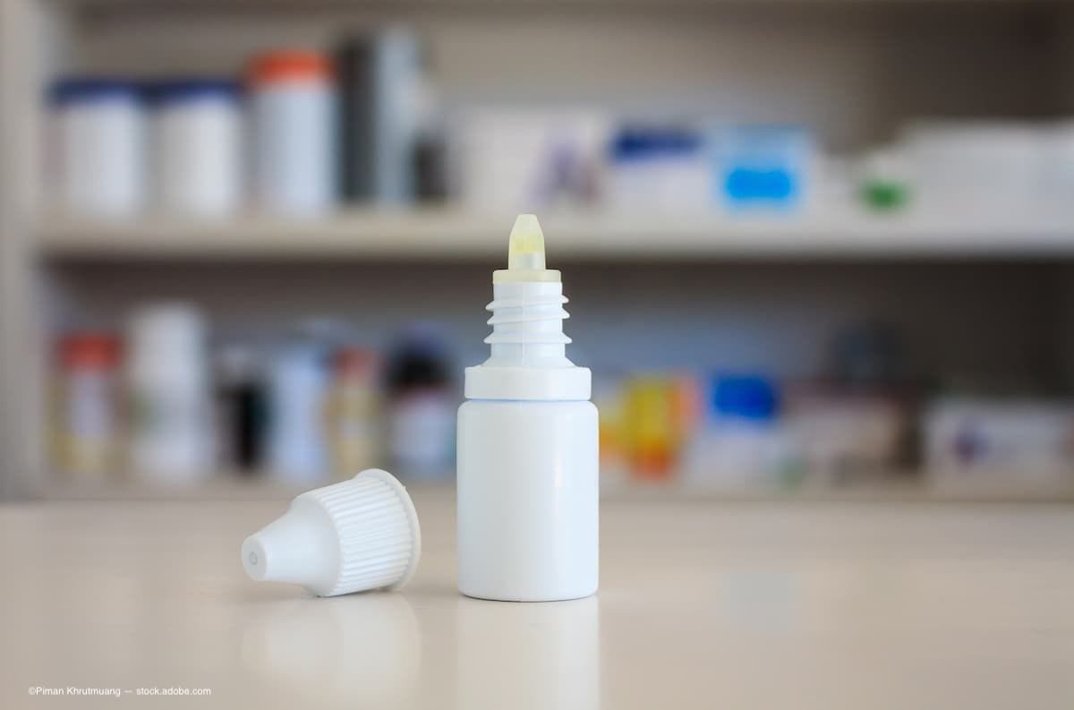 A bottle of eye drops sitting on the counter in a pharmacy. (Image Credit: AdobeStock/Piman Khrutmuang)