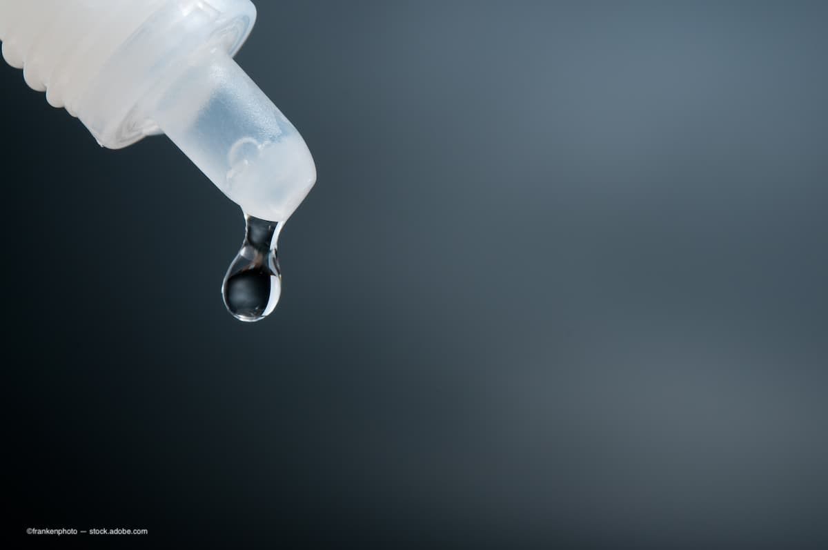 A bottle of eye drops with a drip coming off the tip. (Image Credit: AdobeStock/frankenphoto) 