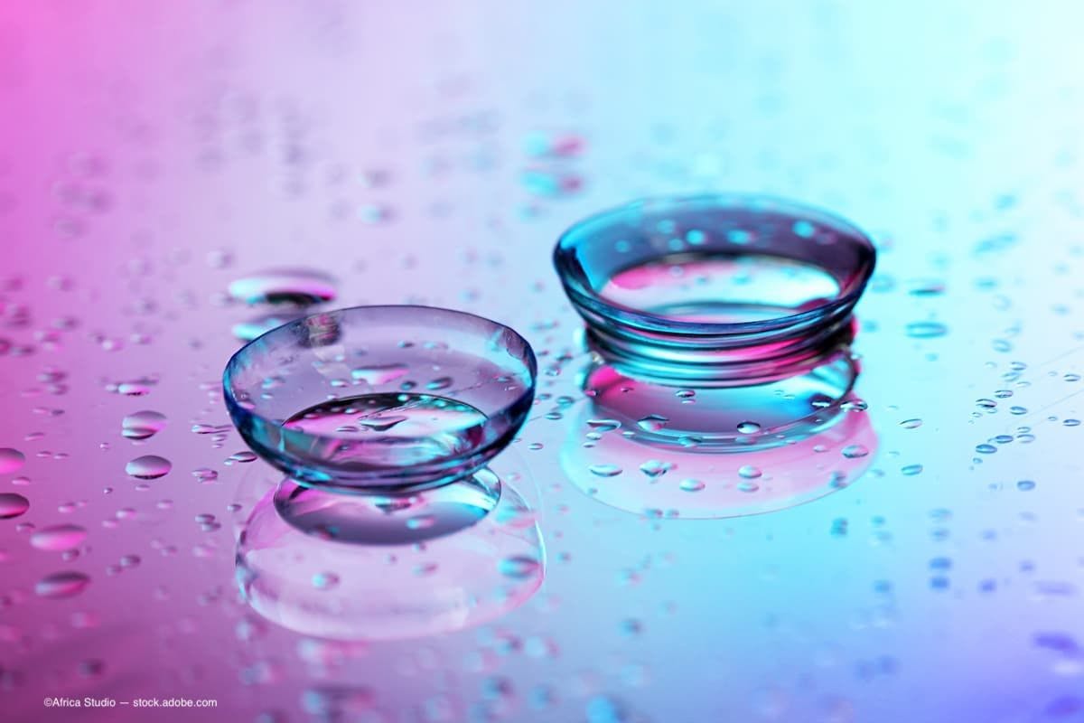 a colorful image of contacts sitting on a table in liquid. (Image Credit: AdobeStock/Africa Studio)