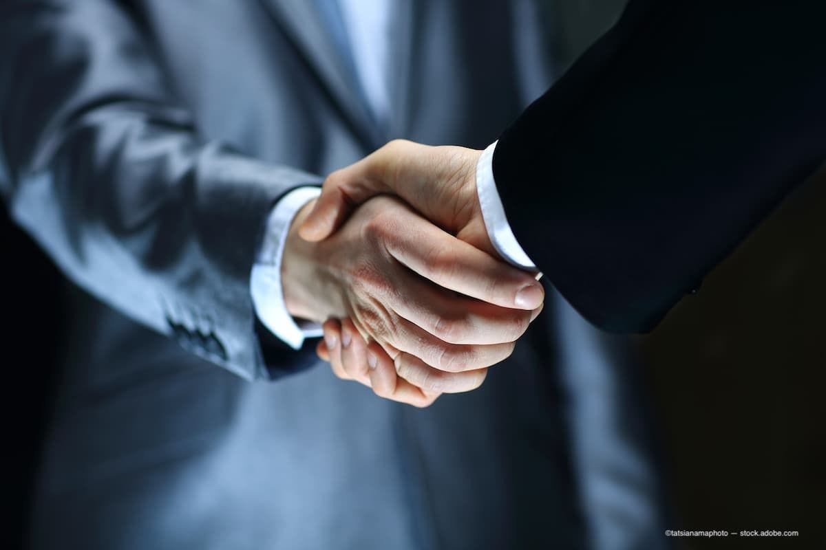 Two business men shaking hands in an agreement. (Image Credit: AdobeStock/tatsianamaphoto)