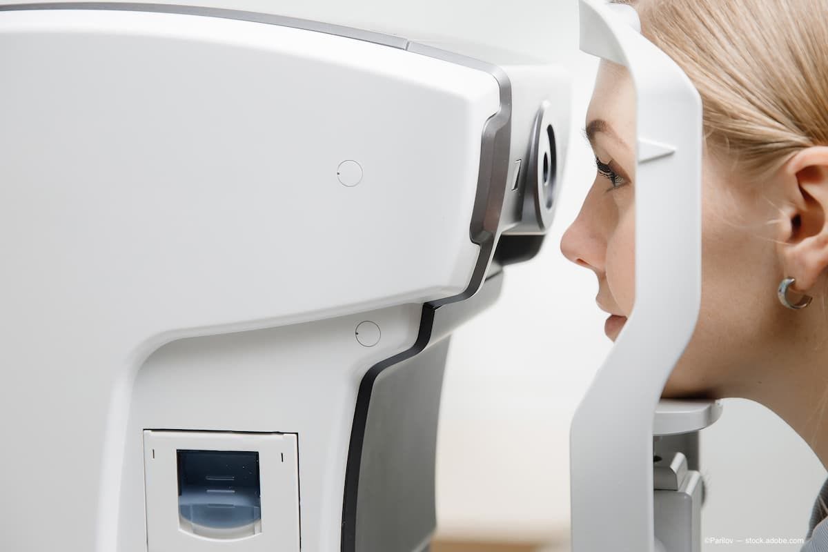a woman getting her eyes checked by an oct machine. (Image Credit: AdobeStock/Parilov)