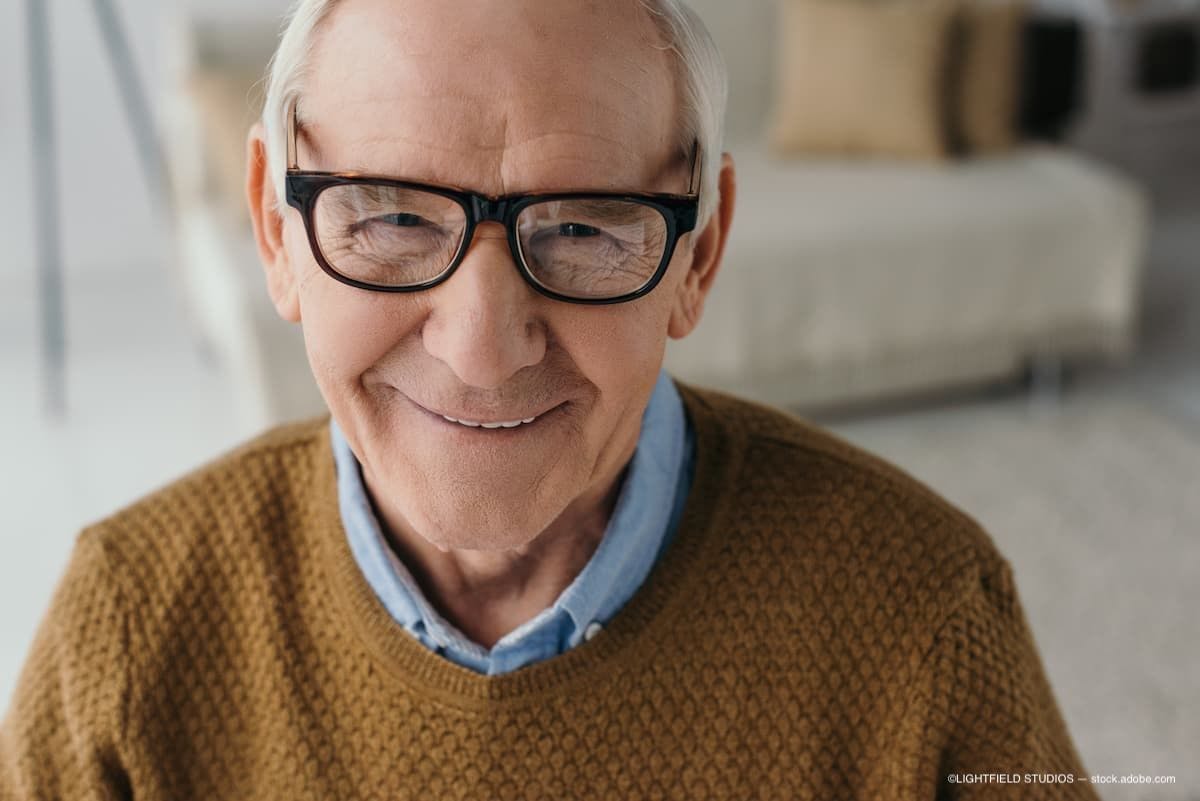 An older man wearing glasses and smiling (Image Credit: AdobeStock/LIGHTFIELD STUDIOS)