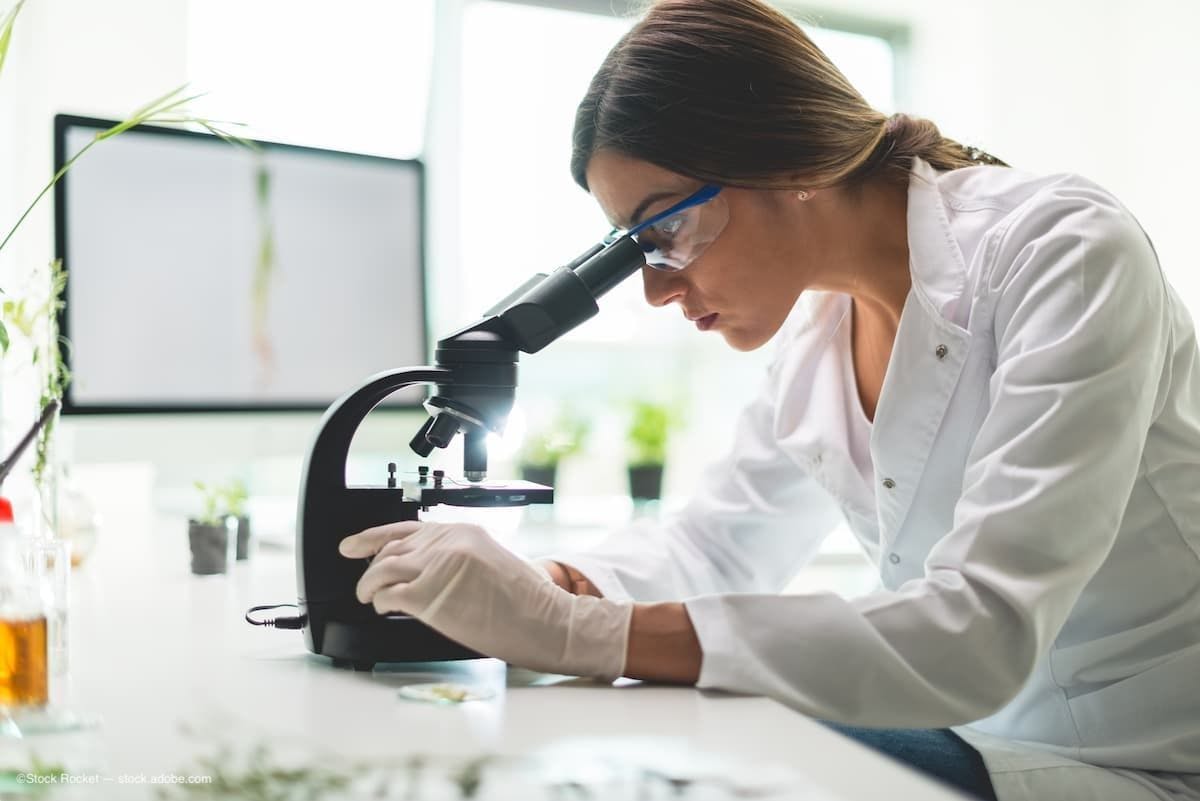 a young female scientist conducting research (Image Credit: AdobeStock/Stock Rocket)