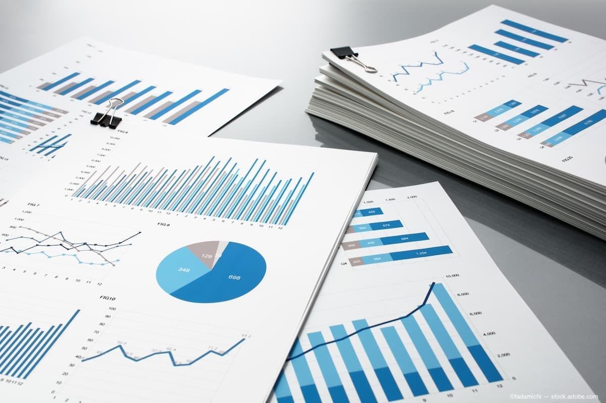reports with data sitting on a desk in piles. (Image Credit: AdobeStock/tadamichi)