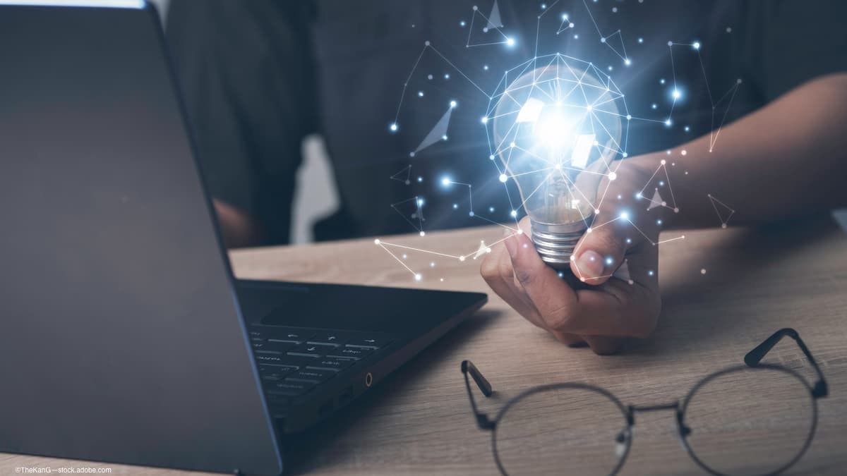 Man on computer with lightbulb and glasses. (image credit: AdobeStock/TheKonG)