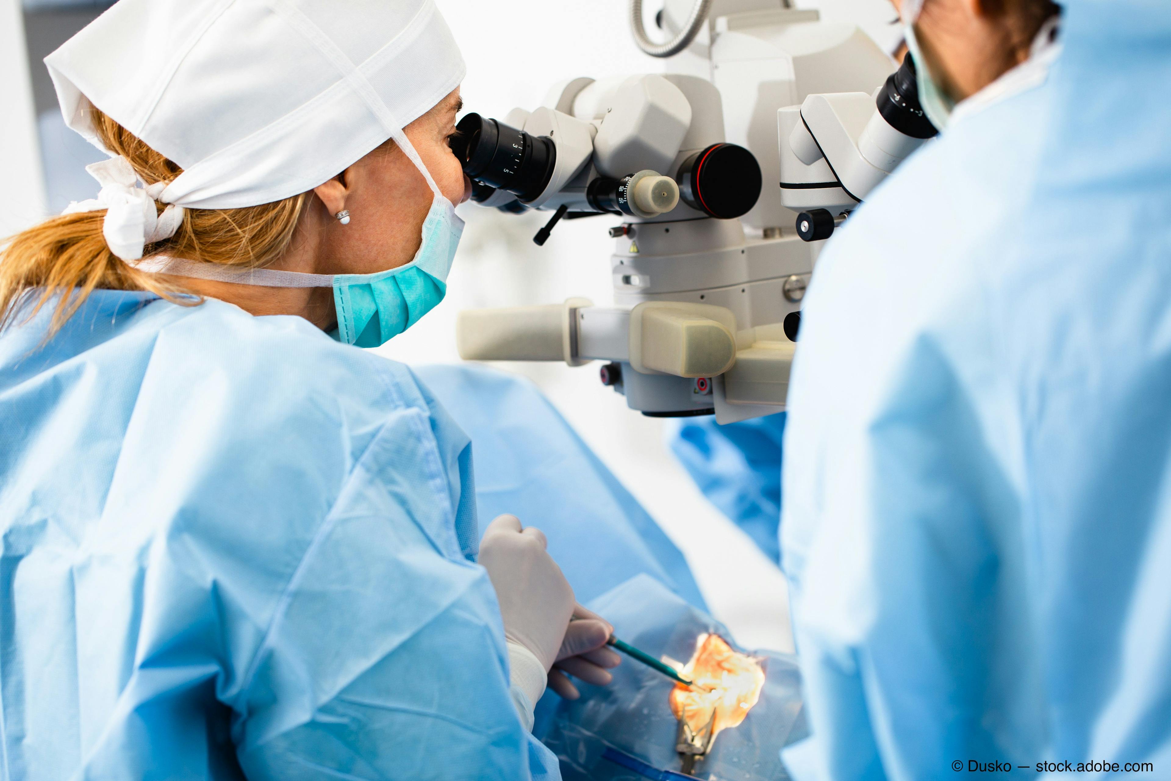 Surgeons perform eye surgery on a patient 
