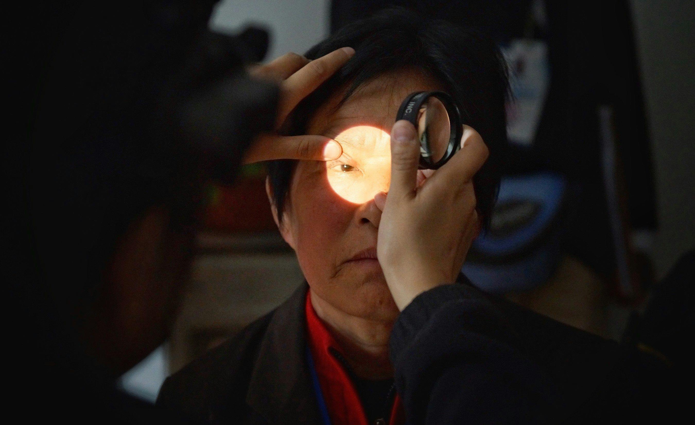 A patient is screened for diabetic retinopathy at a hospital in Jinan, China. (Image courtesy of Geoff Oliver Bugbee)