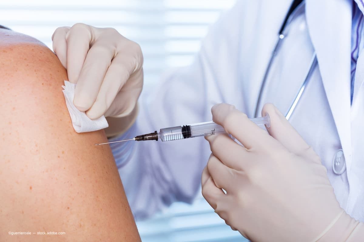 An image of a doctor getting ready to give a patient a vaccination. (Image Credit: AdobeStock/guerrieroale)