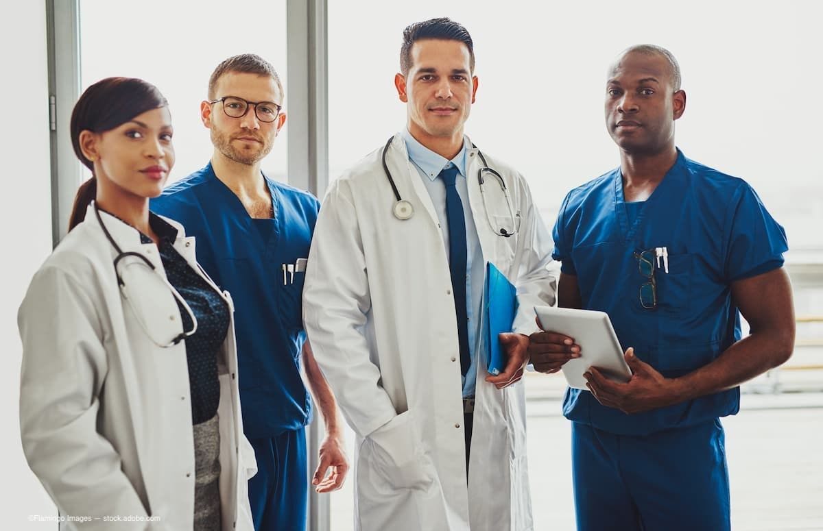 Multiracial group of doctors in a hospital. (Image Credit: AdobeStock/Flamingo Images)