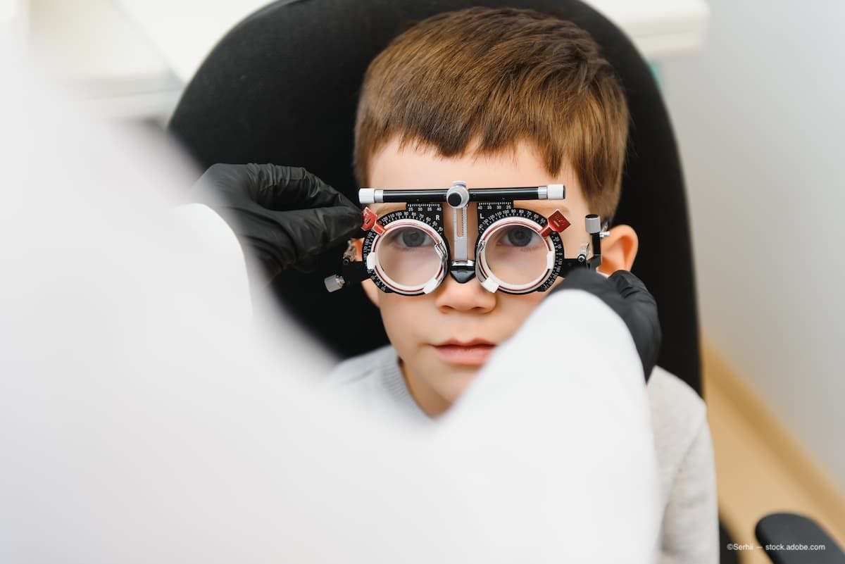 A child getting an eye exam at the ophthalmologists office. (Image Credit: AdobeStock/Serhii)