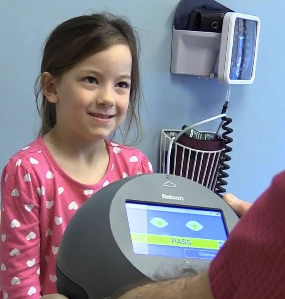 Within seconds of the screening, the pediatric vision screening device calculates a binocularity score based on foveal alignment and provides a “pass” or “refer” result to the clinician. (Image courtesy of Andrew Schuman, MD)